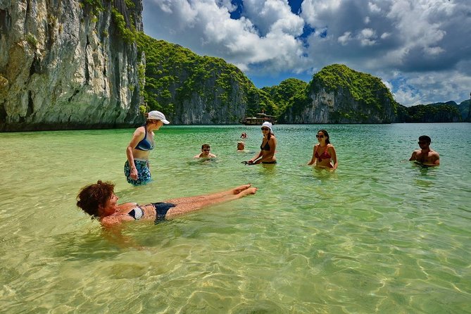 1 Day Boat Tour: HaLong Bay, Lan Ha Bay, Natural Beach and Full Moon Party - Seeing a floating fishing village on the way back