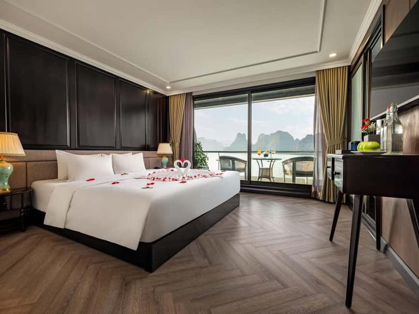 2-Day or 3-Day: Halong&Lan Ha Bay Cruise 5<em> balcony,bathtub – Key points to know before booking’ /></p>
<ul>
<li><strong>The 3-day cruise adds Viet Hai Village:</strong> You can cycle or take an electric car through the village, visit a local home, and explore more of Lan Ha Bay.</li>
<li><strong>Cabins include useful comforts:</strong> Expect a private balcony, bathtub, modern facilities, full amenities, and daily bottled water.</li>
<li><strong>The 2-day plan is the shorter version:</strong> It generally covers the first and final cruise days, with Tra Bau, Dark and Bright Cave, and one night aboard.</li>
<li><strong>Dark and Bright Cave gives you two options:</strong> Paddle yourself by kayak or ride a bamboo boat rowed by local people.</li>
<li><strong>Transport takes time:</strong> The shared limousine from Hanoi takes roughly three hours, followed by a tender boat transfer to the main cruise ship.</li>
<li><strong>Food is the weak point for some people:</strong> Seafood, barbecue, buffet meals, and set menus are included, but expectations should stay moderate.</li>
</ul>
<h2>Choosing between the 2-day and 3-day cruise</h2>
<p><img width="820" height="614" decoding="async" src=