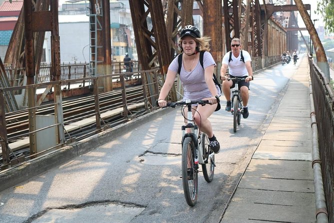 Bicycle Tour Full Day Explore Red River Delta & Rural Villages - Long Bien Bridge and the market crossing