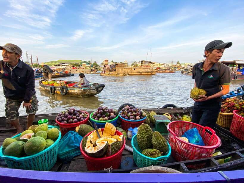 Can Tho: Explore Mekong, Floating Market, Cacao & Local Life - A local boat, fresh pineapple, and the working river
