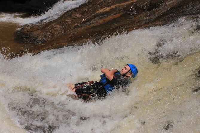 Canyoning Tour in Dalat Viet Nam - The first 18-meter rappel beside a waterfall