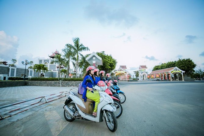 Da Nang Night Motorbike Tour & River Cruise Riding By Lady Rider - Dragon Bridge, Da Nang’s night-time centerpiece