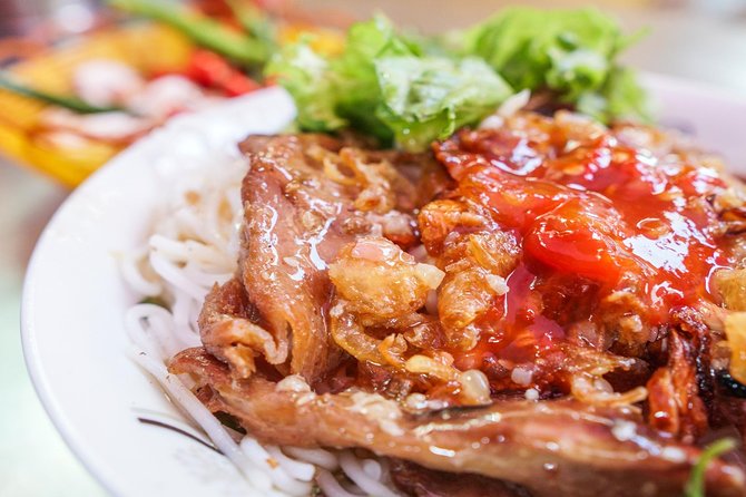 DaNang Night Foodie Tour-Sighseeing with Aodai Lady Rider Private - Why a motorbike makes sense after dark