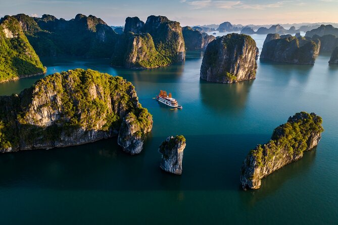 Emperor Cruises Experience 2 Days 1 Night in Halong Bay. - Kayaking, caves, and quiet beaches