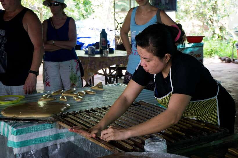 Essential Mekong Delta: Highlight Tour from Ho Chi Minh City - Coconut candy shows the working side of the delta