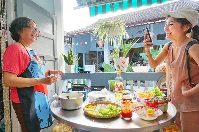Evening Walking Food Tour, folk game and lantern boat - Backstreets, Old Town stories, and a little local history