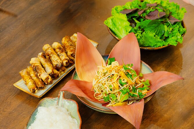 Experience Hanoi Cooking Class with Free Wine Tasting - Moving from market stall to cooking studio