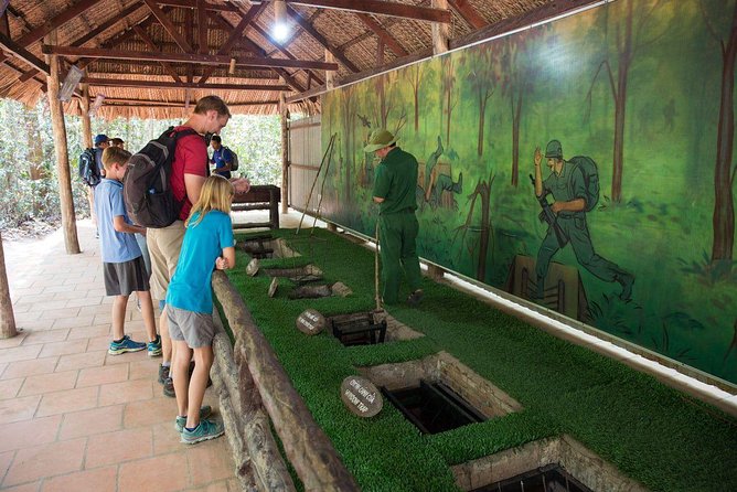 From Ho Chi Minh: Cu Chi Tunnels Half-Day History Tour with Guide - Walking through the tunnel area