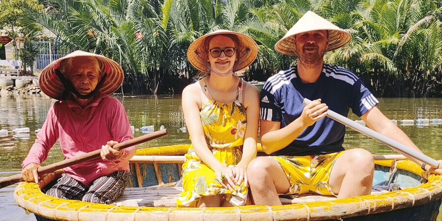 From Hoi An: Bay Mau Coconut Forest Bamboo Basket Boat Ride - Meeting the pink-shirt greeter in Hoi An