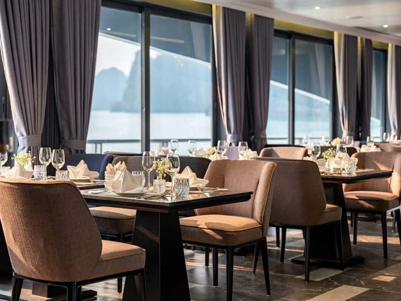 Full Day: Fabulous Halong Bay Tour with Taliya Cruise 5<em> – Key points at a glance’ /></p>
<ul>
<li><strong>Dark and Bright Cave by bamboo boat:</strong> A local rower takes you through a quiet cave passage toward a lagoon ringed by limestone cliffs.</li>
<li><strong>Ao Ech kayaking and swimming:</strong> You get time in the water, a welcome extra on a day cruise where swimming is not always permitted.</li>
<li><strong>Lan Ha Bay route:</strong> The cruise moves beyond the standard Halong Bay sights into a quieter area with about 400 islands.</li>
<li><strong>Seven-hour five-star boat:</strong> Expect an air-conditioned restaurant, sundeck, outdoor Jacuzzi, lunch, and a more polished setting than a basic excursion boat.</li>
<li><strong>Sunset and spring-roll class:</strong> The final hours combine a short Vietnamese cooking demonstration with free time on deck.</li>
<li><strong>Hanoi transfers are optional:</strong> The return drive can run late, with the listed arrival in Hanoi around 7:45 to 8:15 p.m.</li>
</ul>
<h2>A long day from Hanoi to the limestone islands</h2>
<p><img width="820" height="614" decoding="async" src=