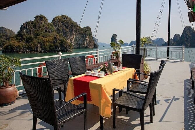 Halong bay 4 hours boat tour from Halong city with 2 caves, kayak - A private wooden boat in central Ha Long Bay