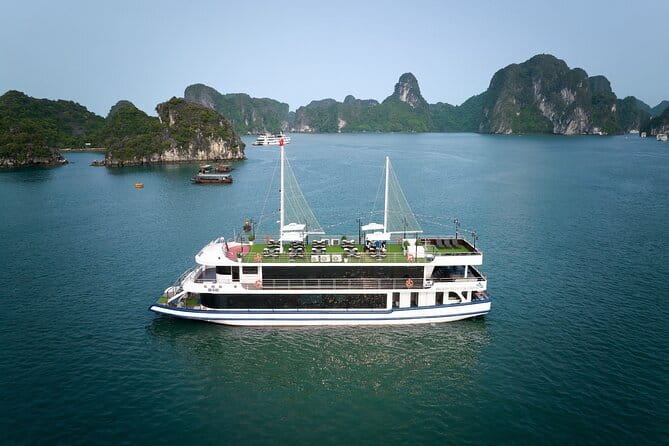 Halong bay 4 hours boat tour from Halong city with 2 caves, kayak - Dinh Huong and Fighting Cock islets