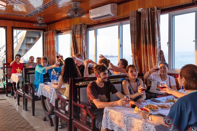 Halong Bay Day Tour With Titop Island, Cave, Kayak & Lunch - Sunset snacks on the return cruise