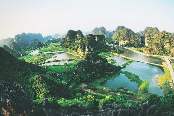 Hanoi - Hoa Lu - Tam Coc - Mua Cave - 1 Day Tour. By Luxury Limousine From Hanoi - Climbing Mua Cave for the big view