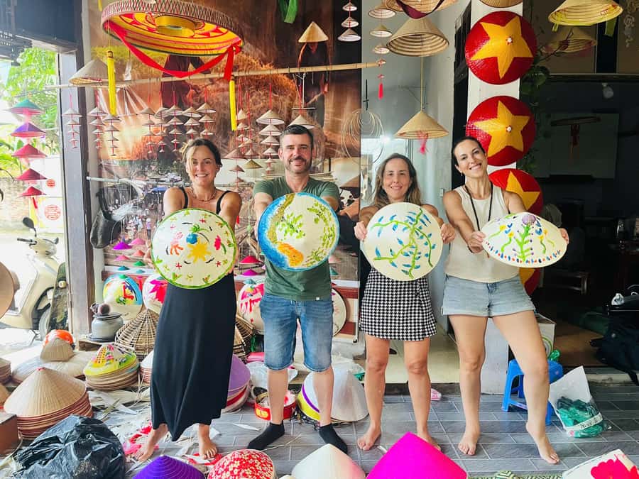 Hanoi: Incense Village, Hat, Lacquer, & City Highlights Tour - Painting a conical hat in Chuong Village