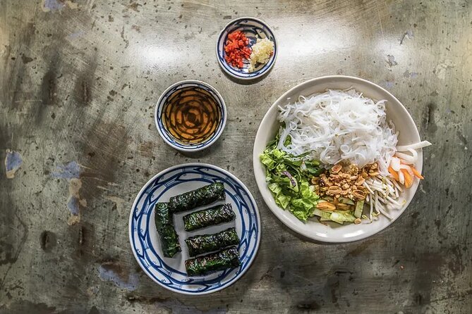 Hanoi Street Food Tour By Motorbike + Sightseeing SAFE & FUN - Steamed rice pancakes in the Old Town