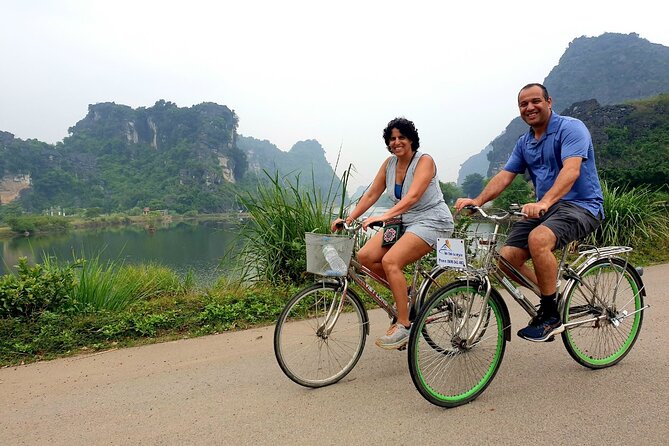 Highlight Ninh Binh Full Day Tour Tam Coc Boat, Mua Cave, Hoa Lu - Cycling through village lanes near Ninh Binh