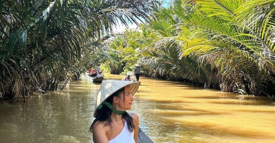 Ho Chi Minh City: Discover Mekong Delta & Coconut Village - A sampan through coconut-lined canals