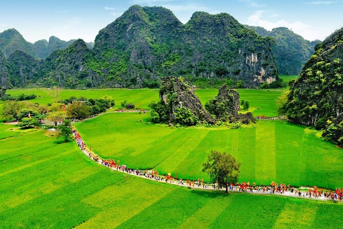 Hoa Lu - Tam Coc - Ninh Binh Day Tour: Biking, Visit Local Family - Rowing through Tam Coc for about 90 minutes
