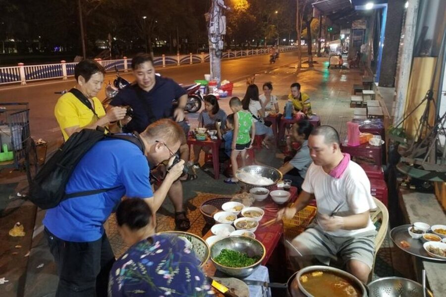 Hue: Night Street Food Tour by Cyclo with a Local Guide - Com hen brings the Perfume River to your plate