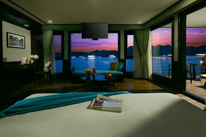 Peony Cruise 5</em> Lan Hạ Bay 2 days 1 night with 2 ways transfer – The Hanoi pickup from 8:30 to 8:50′ /></p>
<p><p>Your morning begins with pickup between 8:30 and 8:50. The limousine bus collects you from a hotel in Hanoi’s Old Quarter or from 34 Hoa Ma, Hai Ba Trung.</p>
</p>
<p><p>This is useful if you are staying in the central hotel area, since you do not need to find your own way to the port. The air-conditioned vehicle is included, as are the main fees and the guide.</p>
</p>
<p><p>The pickup wording deserves attention. A guest found the arrival and departure arrangements unclear at first, although the company called the day before to explain them. I would still confirm your hotel address, pickup time, and return drop-off before departure. The booking information also shows a start time of 12:00 am, which conflicts with the morning pickup schedule, so ask the operator to confirm the correct time.</p>
</p>
<p><p>The drive is part of the package, but the provided information does not give a precise road duration. Keep your morning open rather than planning another activity before boarding.</p>
</p>
<h2>Boarding at Tuan Chau around midday</h2>
<p><img width="669" height="446" decoding="async" src=