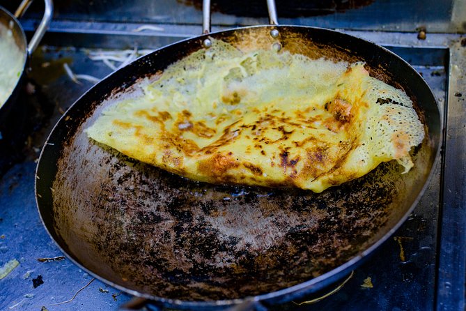 Private Street Food Evening Walking Tour in Ho Chi Minh City - Bo la lot and local noodle dishes