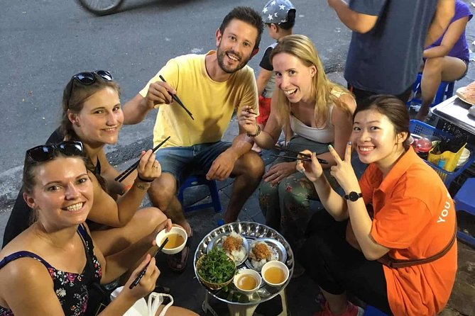 Small-Group Street Food Cyclo Tour of Hanoi Old Quarter - Riding a cyclo through central Hanoi