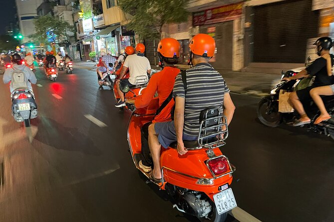 Vespa Female Ao Dai riders Night Street Food + See Train Street - Should you book this Hanoi Vespa food tour?