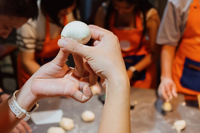 Vietnamese Bread & Brew: Banh Mi Baking Class & Specialty Coffee - Choosing meat or tofu and mixing the sauces