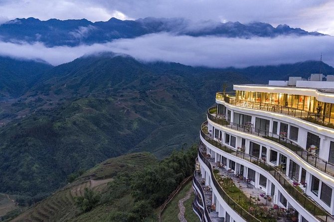 VIP LUXURY Sapa 2D1N -TRANSFER BY LUX LIMOUSINE CAR (Stay at 5<em> hotel) – Leaving Hanoi before breakfast’ /></p>
<p><p>Pickup is scheduled between 6:45 and 7:00 a.m. from hotels in Hanoi’s Old Quarter, with a stated meeting time of 6:30 a.m. I would be ready early and keep your phone available, since pickup timing has not always been exact.</p>
</p>
<p><p>The trip follows the highway toward Lao Cai. Around 9:30 a.m., you stop in Lao Cai City for breakfast, then continue toward Sapa, with another stop around 11:00 a.m. The schedule gives you a practical break during a long morning on the road.</p>
</p>
<p><p>The limousine is air-conditioned, which matters in Vietnam’s heat and makes the transfer easier than a basic crowded vehicle. Still, the word VIP does not turn the road into a short hop. You are giving up much of the morning to reach the mountains, so do not expect to begin trekking at sunrise.</p>
</p>
<p><p>Keep only what you need for the night and walking portion within easy reach. On the second morning, you can leave larger luggage at the hotel reception storage and carry a light pack. That is a small but useful detail, especially if you are traveling with more than one bag.</p>
</p>
<h2>Cat Cat Village and its waterfall</h2>
<p><img width="669" height="446" decoding="async" src=